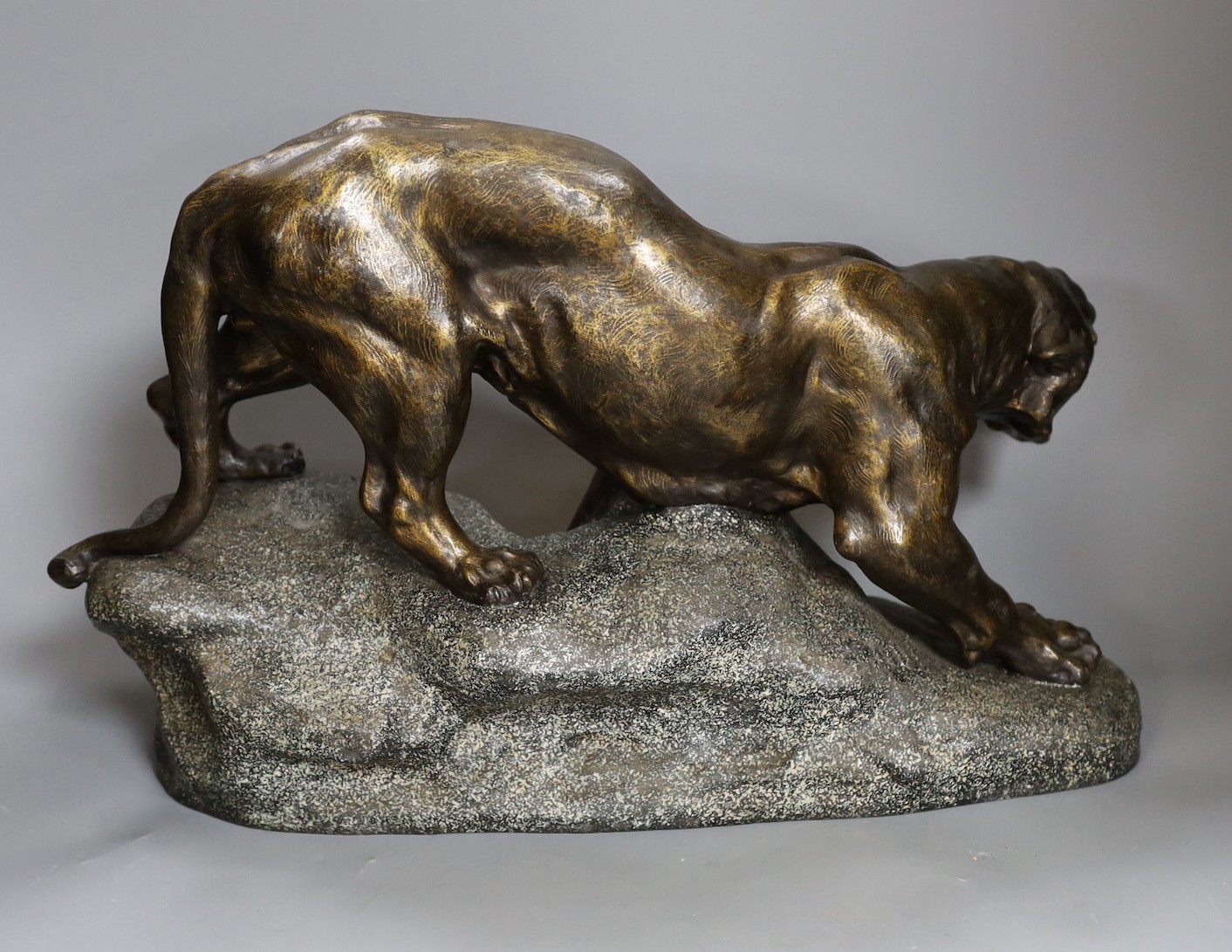 After Thomas François Cartier (1879-1943) patinated spelter model of a tiger, 49cm long